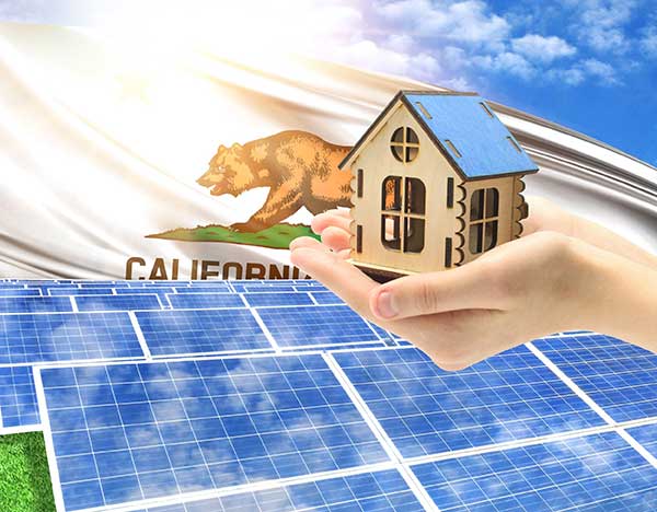 Deregulated Energy Markets Hand holding house over solar panels