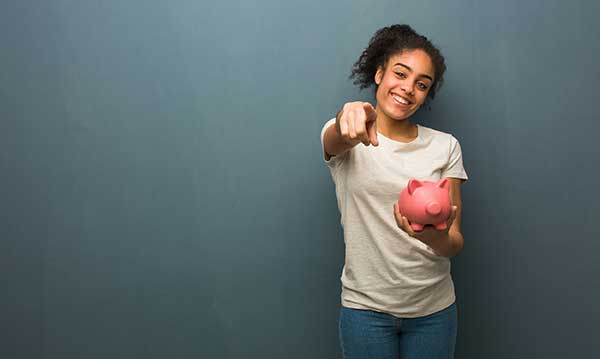 Kilowatts Learning | image of young girl holding piggy bank