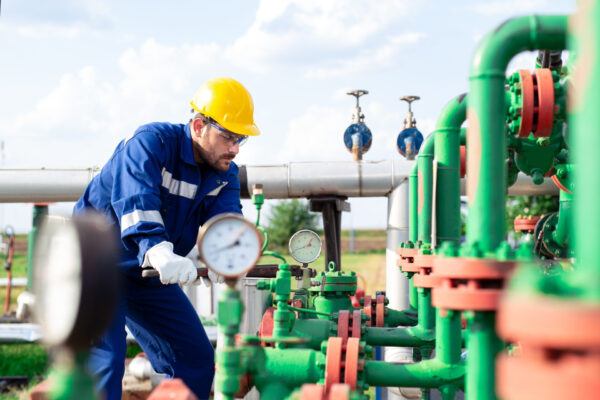Oil Needed for Gas | Image of Technician Working on Gas Pipes