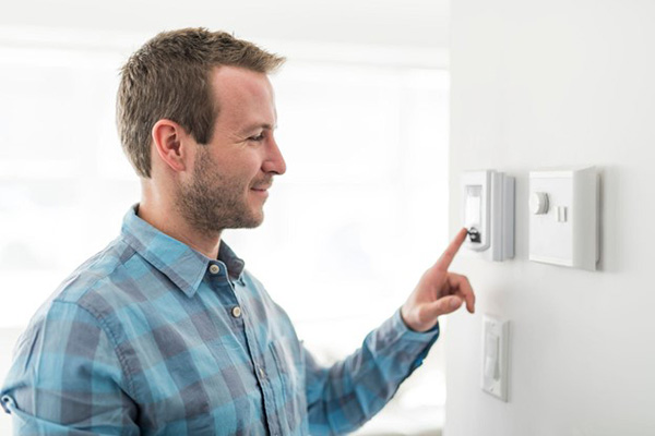 Man Adjusts Energy At Home Settings