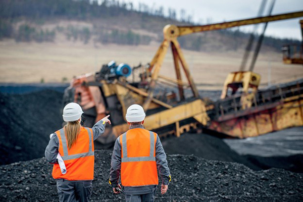 Workers Watching Coal Excavation Process in Quarry