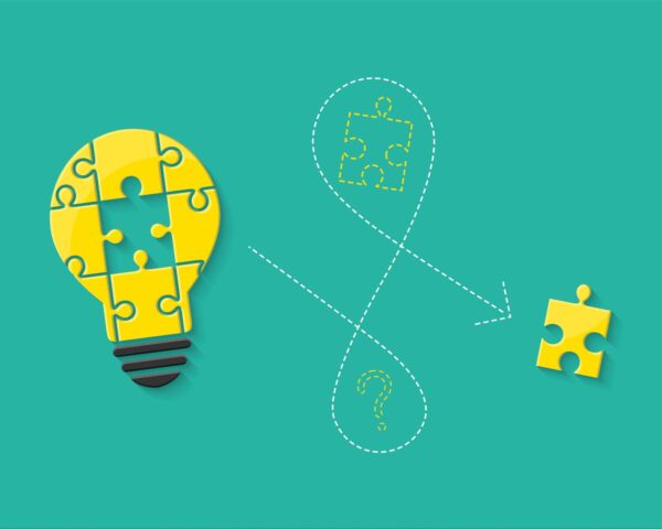 An image of a lightbulb made of puzzle pieces