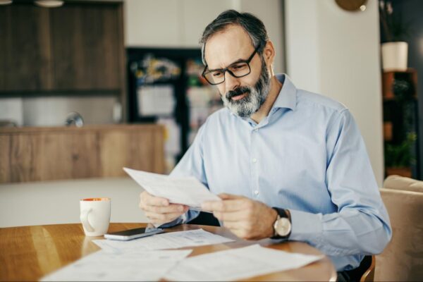 man reviewing energy bill